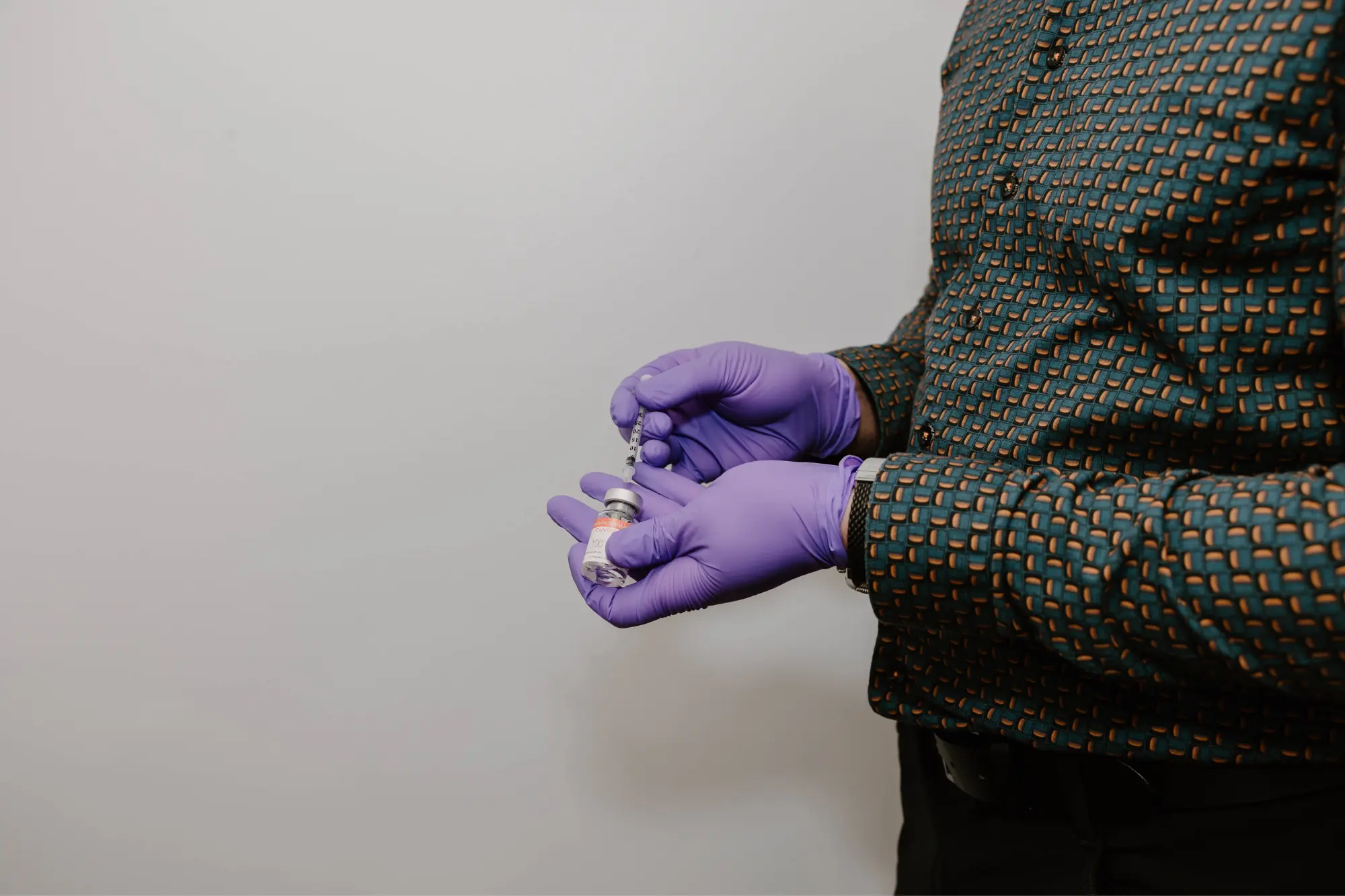 Biltmore Dermatology Worker filling syringe for injectable treatment